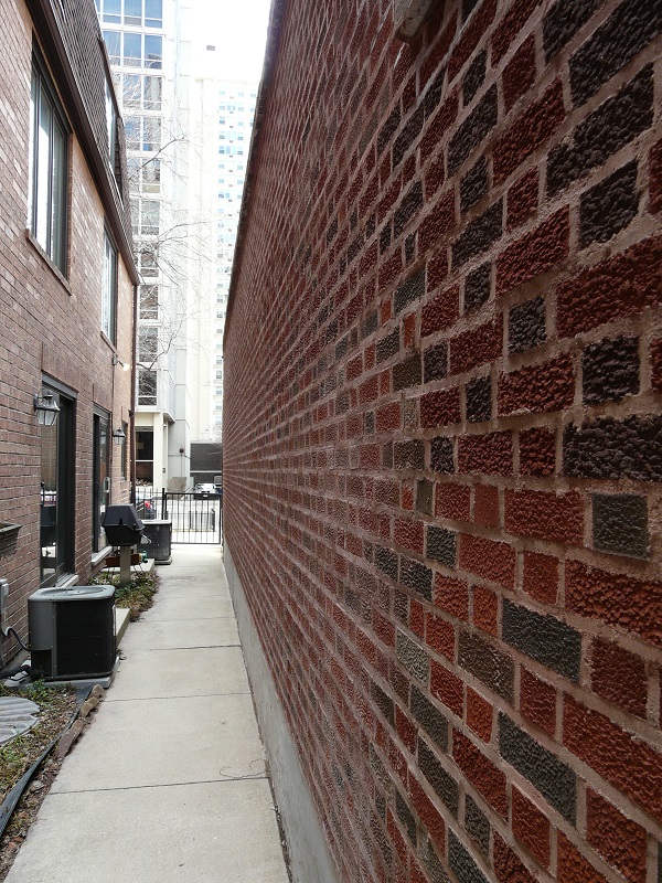 brick wall and a sidewalk