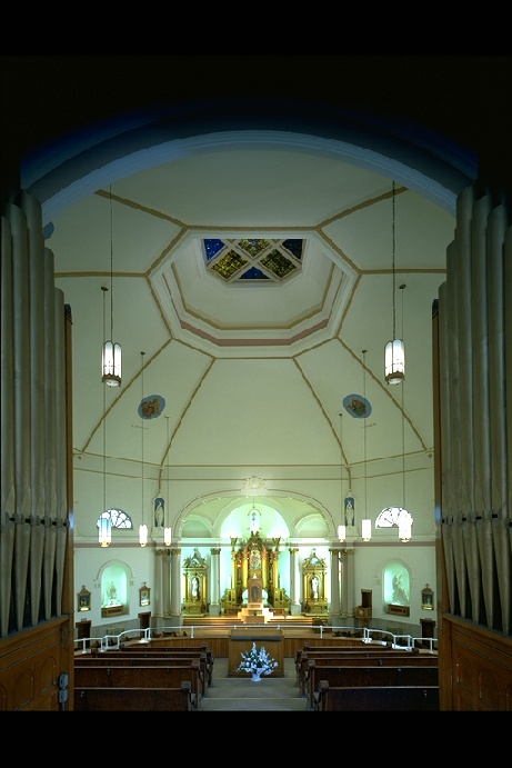 Freshly painted church sanctuary with octagonal dome ceiling and gilded altar — church interior painting in Chicago by Fortune Restoration