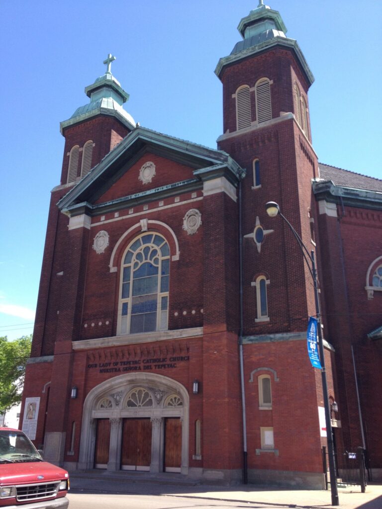 Our Lady of Tepeyac Catholic Church in Chicago, a twin-tower brick church maintained through masonry restoration and tuckpointing