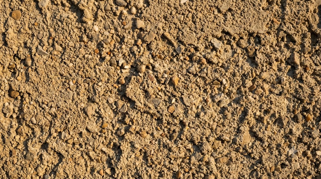 Close-up of coarse dash-finish stucco texture on a Chicago home exterior